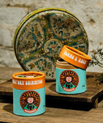 The Scrubber natural powder dry shampoo in 100% recycled cardboard packaging, in a ylang and rose scent