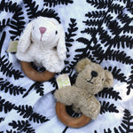 Senger bear and sheep baby grasping toys placed on an Etta Loves fern print sensory muslin cloth.