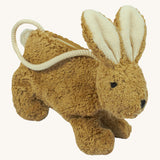 A Senger beige coloured rabbit bag on a plain background.