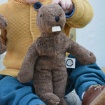 A Senger small floppy beaver on a child's lap. 