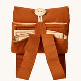 Senger cozy nap baby play mat. A padded blanket designed for babies to have a comfortable space whilst out and about. The may is shown rolled up and closed by the button and loop. 