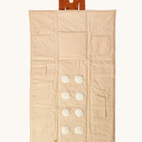 Senger cozy nap baby play mat. A padded blanket designed for babies to have a comfortable space whilst out and about. This side of the mat has elements for baby to touch. 