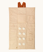 Senger cozy nap baby play mat. A padded blanket designed for babies to have a comfortable space whilst out and about. This side of the mat has elements for baby to touch. 