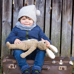 holding the Senger Large Floppy Bunny Toy in their arms