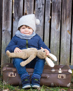 holding the Senger Large Floppy Bunny Toy in their arms