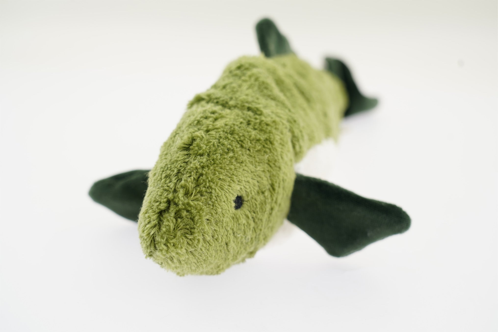 A head-on view of the Senger organic cotton cuddly stuffed fish toy