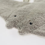A closeup of the Senger organic cotton stuffed manta ray's cute face