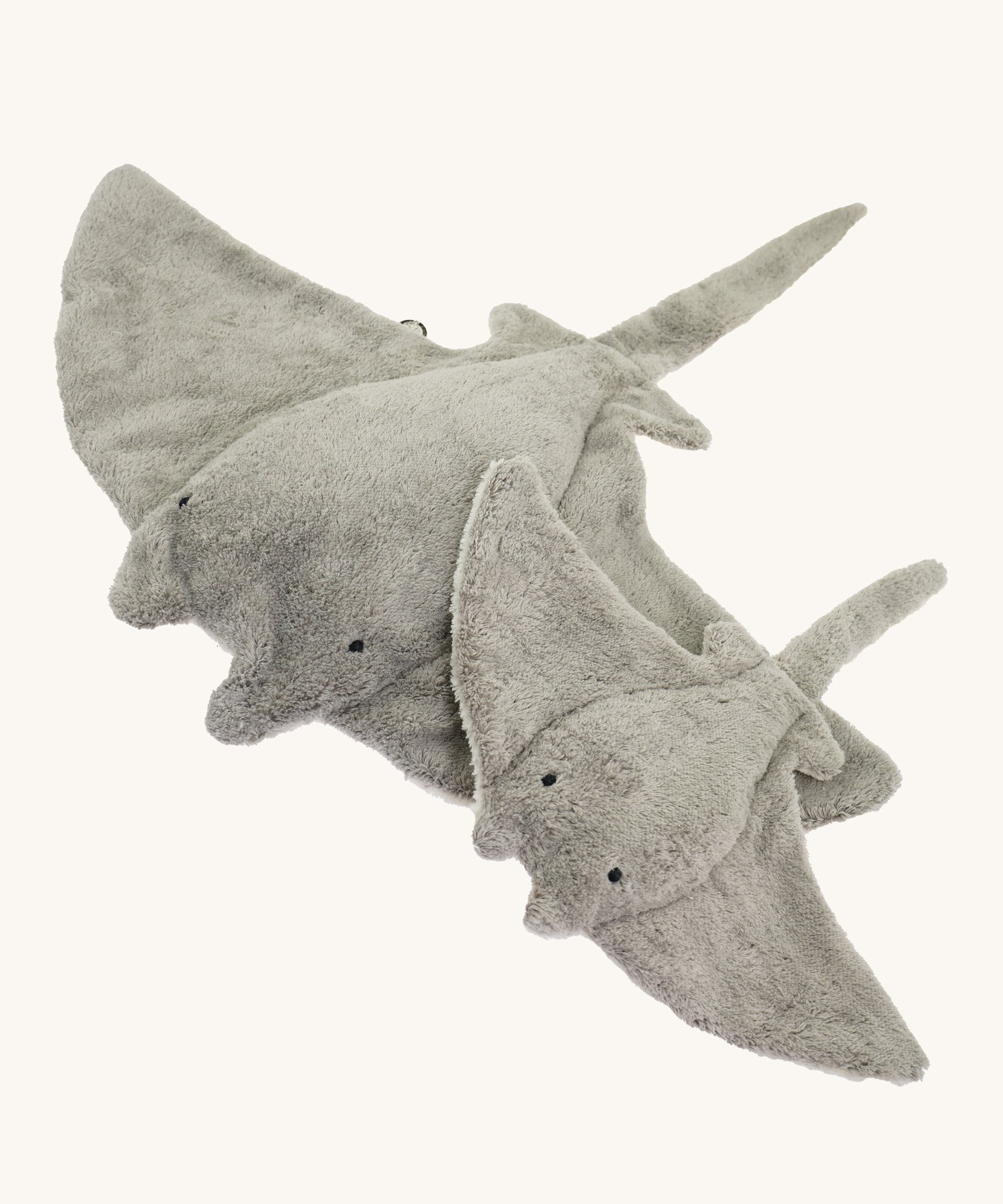 The large and small Senger organic cotton stuffed grey manta rays next to each other
