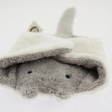 The Senger organic cotton grey stuffed manta ray cuddly toy, with its fins folded over its head
