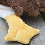 A close up of one of the yellow coloured flippers on the Senger Large Cuddly Drake Duck soft toy.