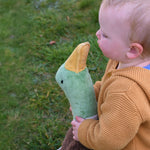 A close up of the head of the Senger Large Cuddly Drake Duck. The soft toy is being held by a young child.