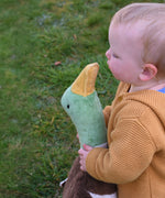 A close up of the head of the Senger Large Cuddly Drake Duck. The soft toy is being held by a young child.