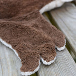A close up of one of the brown coloured wings on the Senger Large Cuddly Drake Duck soft toy.