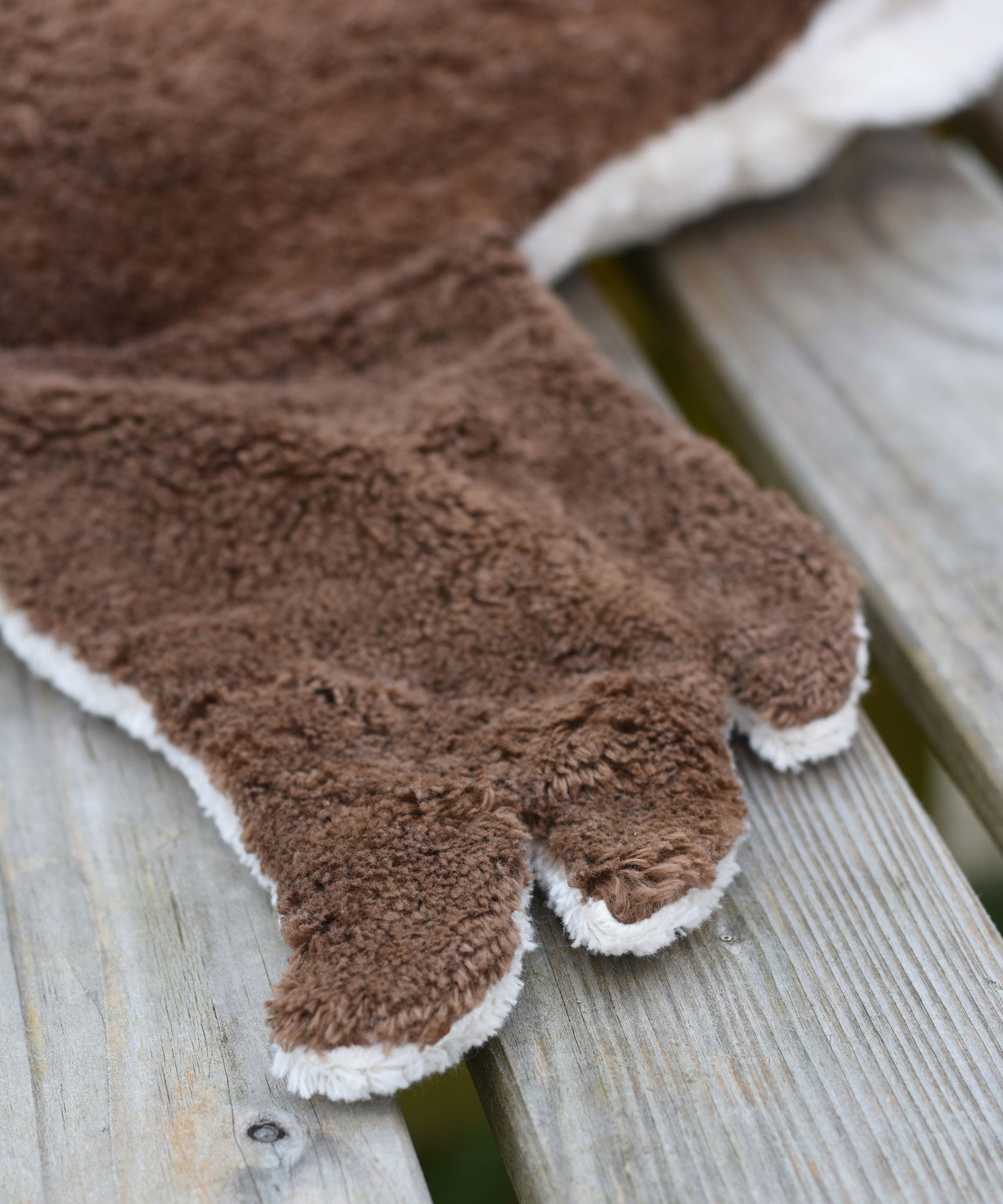 A close up of one of the brown coloured wings on the Senger Large Cuddly Drake Duck soft toy.