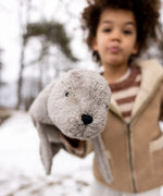Child showing a close up of the large Senger grey cuddly soft toy