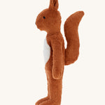 A side profile view of the Senger Large Floppy Squirrel soft toy.