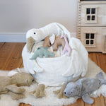 A Senger Goose bean bag shown with smaller Senger animals placed on it.