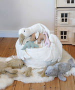 A Senger Goose bean bag shown with smaller Senger animals placed on it.