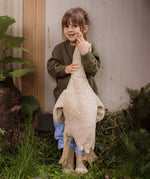 A child holding a Senger Large Cuddly Goose organic soft toy in a creamy Linen colour. These soft toys are created from the highest quality, sustainable and traceable natural materials. Senger cuddly animal toys and soft dolls are handmade in Germany with love and attention to detail and we are proud Senger stockists here at Babipur. 