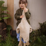 A child holding a Senger Large Cuddly Goose organic soft toy in a creamy Linen colour. These soft toys are created from the highest quality, sustainable and traceable natural materials. Senger cuddly animal toys and soft dolls are handmade in Germany with love and attention to detail and we are proud Senger stockists here at Babipur. 