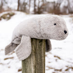 A large Senger seal placed on a wooden post.