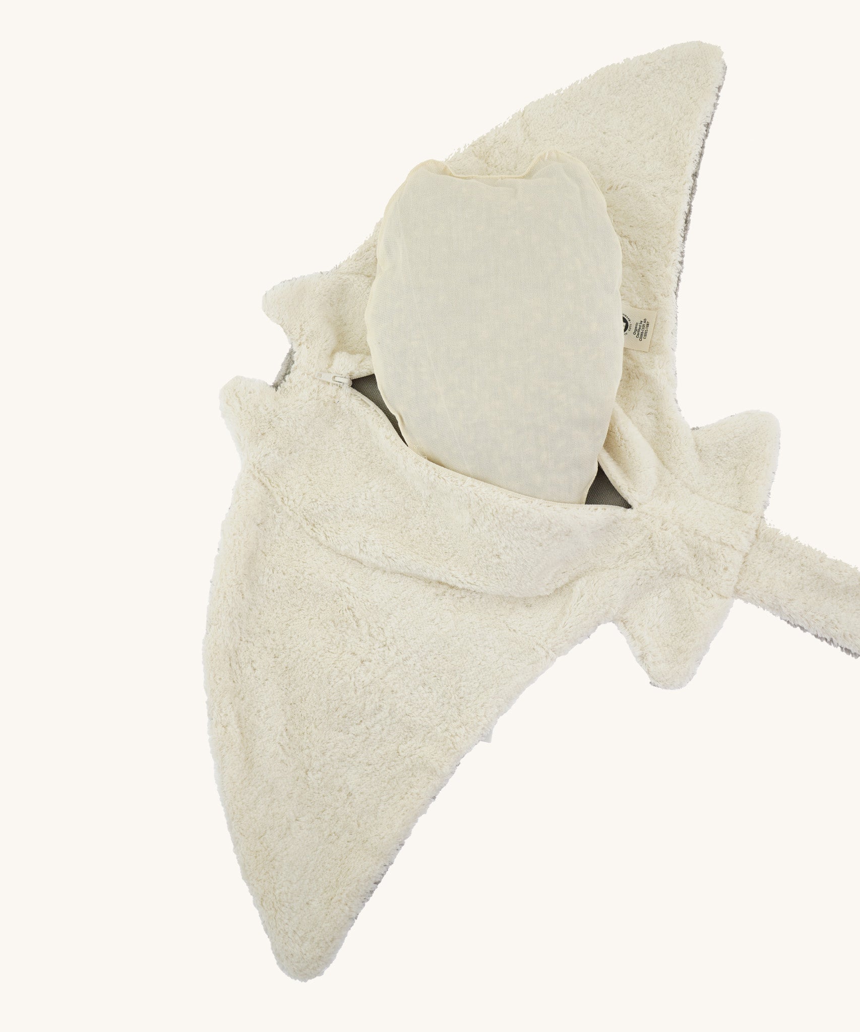 The under side of the Senger large organic cotton manta ray cuddly toy, with the heatable inside bag half out