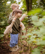 Two children walking in a forest, one is holding a Senger Large Cuddly Goose organic soft toy in a creamy Linen colour. The other child has the smaller version of the goose. These soft toys are created from the highest quality, sustainable and traceable natural materials. Senger cuddly animal toys and soft dolls are handmade in Germany with love and attention to detail and we are proud Senger stockists here at Babipur. 