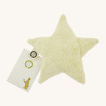 Senger warming star cushion. A light yellow fluffy GOTS organic cotton cushion that can be warmed up with a small gift pouch attached to the label