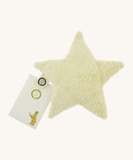 Senger warming star cushion. A light yellow fluffy GOTS organic cotton cushion that can be warmed up with a small gift pouch attached to the label