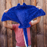 A person holding up the Senger organic cotton stuffed manta ray cuddly toy