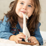 A child playing with the Senger Giraffe Grabber. 