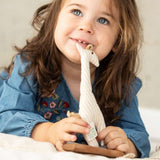 A child playing with the Senger Giraffe Grabber. 