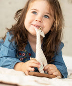 A child playing with the Senger Giraffe Grabber. 