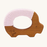 Senger Wooden Yarn Pig Teether. A wooden pig shaped clutching and teething toy for babies decorated with light pink coloured yarn wrapped around the wood. This baby toy is part of a wide range of Senger baby toys and organic soft toys available here at Babipur. 
