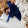 The Senger small cuddly manta Ray stuffed organic toy, being held by a toddler