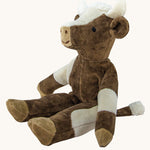 Senger Small Floppy Cow soft toy in a sitting position.