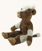 Senger Small Floppy Cow soft toy in a sitting position.