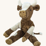 Senger Small Floppy Cow soft toy in a sitting position.