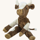 Senger Small Floppy Cow soft toy in a sitting position.