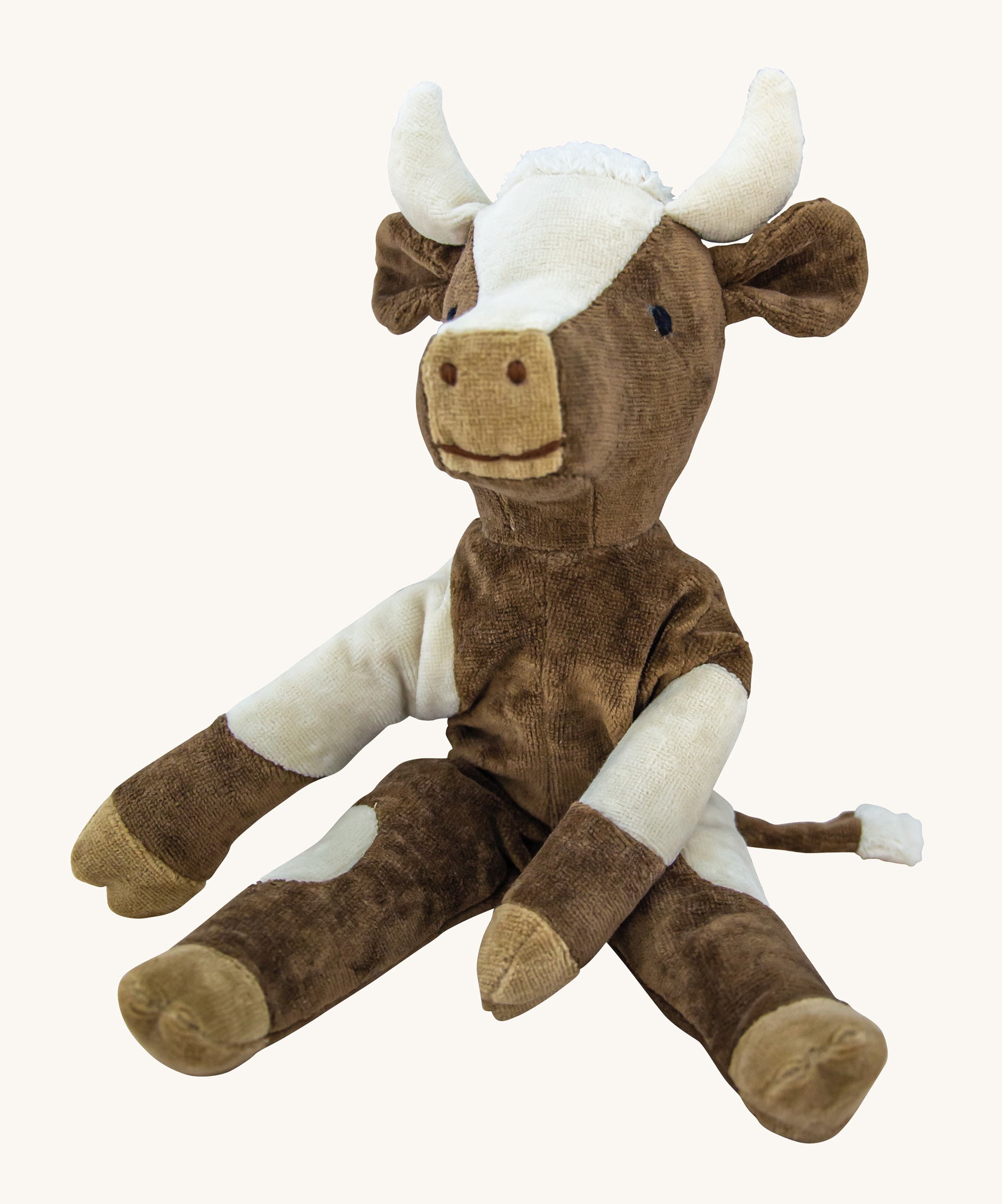 Senger Small Floppy Cow soft toy in a sitting position.