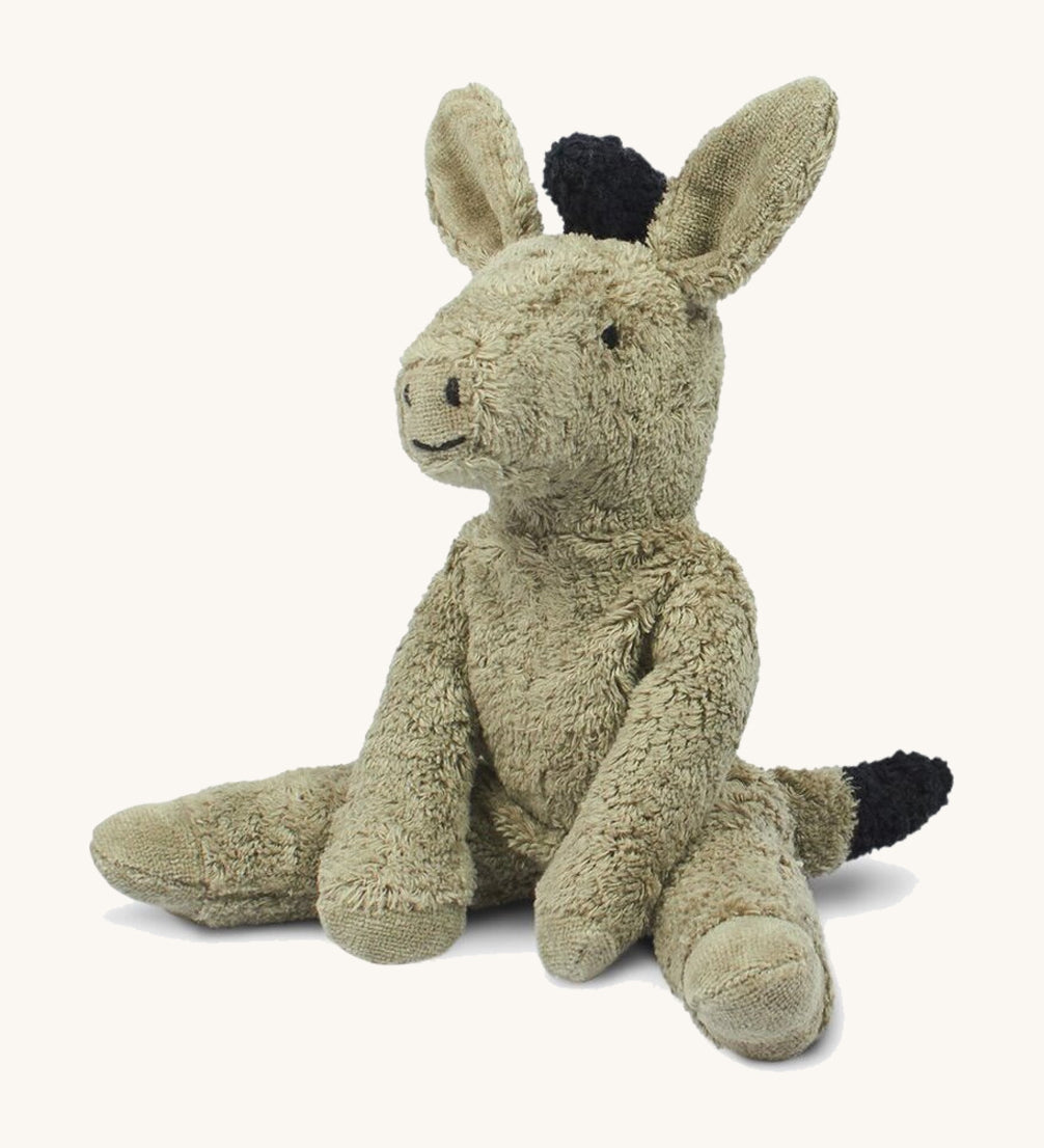 The Senger small floppy donkey - a cuddly, organic cotton stuffed animal with a natural wool filling. It has grey plush fur and is in a seated position. 