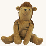 A Senger Small Floppy Hedgehog placed in a seated position.