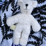  Senger white baby bear placed on an Etta Loves fern print sensory muslin cloth.