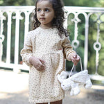 A child holding the Senger White Rabbit Bag. 