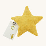 Senger warming star cushion. A yellow fluffy GOTS organic cotton cushion that can be warmed up with a small gift pouch attached to the label