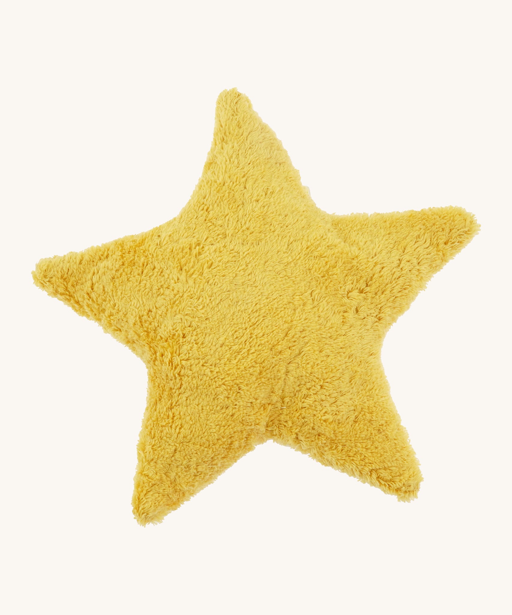 Senger warming star cushion. A yellow fluffy GOTS organic cotton cushion that can be warmed up.