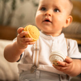  looking down and engaging with the Sophie The Giraffe - Once Upon A Time 5 Senses Musical Balls set