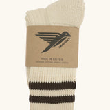 Folded Silverstick Air Organic Cotton Sports Socks in cream with corvo brown stripes.