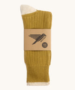The Silverstick Caburn Organic Cotton Socks in the Vintage colourway shown folded over and placed in their cardboard packaging sleeve.