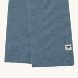 A close up of the logo label on the Silverstick Cirrus Merino Wool Scarf in a Celeste blue colour. Silverstick are proudly made in the UK and stocked here at Babipur. 